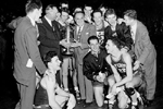 Holy Cross Men's Basketball Team with 1947 NCAA Championship Trophy