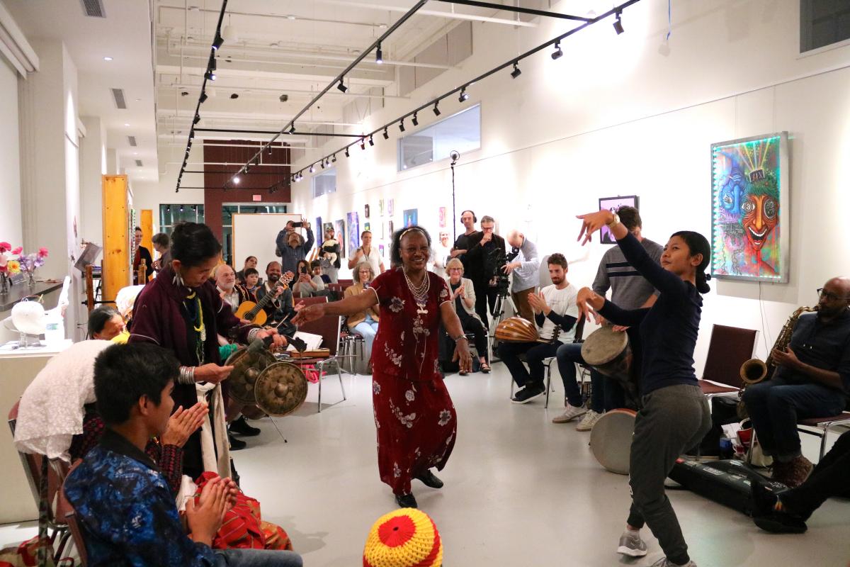 Community members dance during a Jam Session with Silkroad