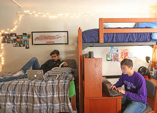 two students study in their room