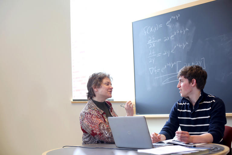 a student meeting with Catherine Roberts, professor of mathematics