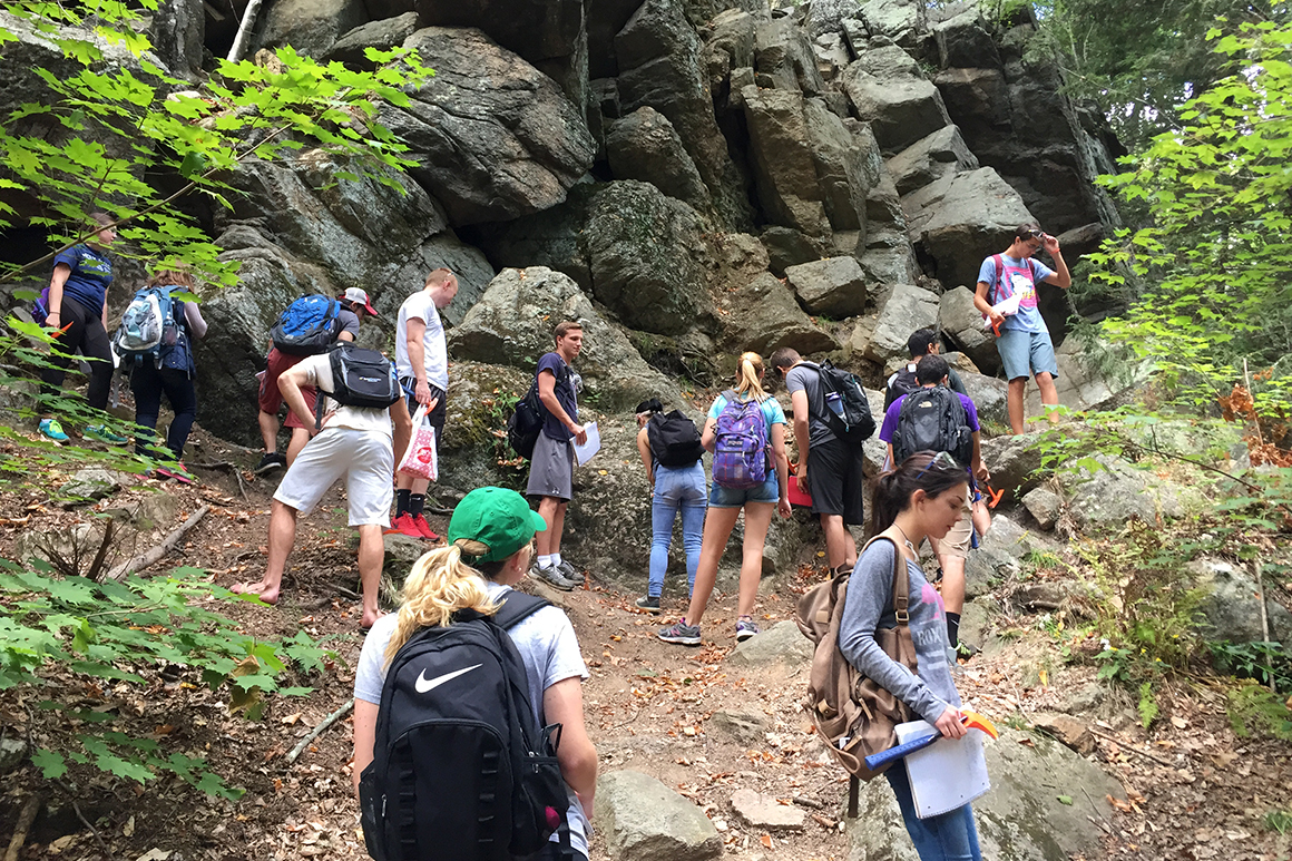 Students observe rock formations at Purgatory Chasm in Sutton, Massachusetts.