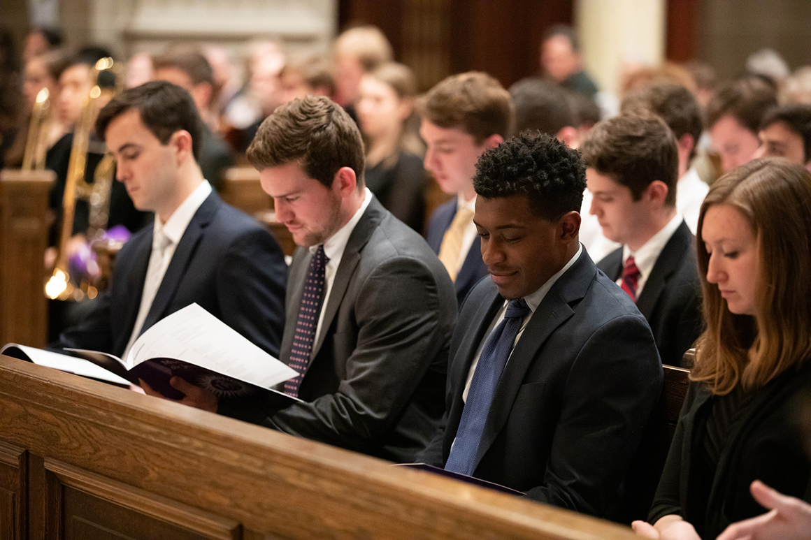 students sitting in the chapel