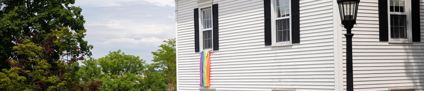  rainbow flag hangs outside window of campion house
