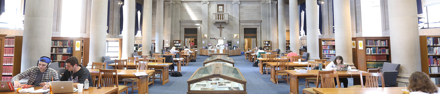 inside the dinand main reading room. students sitting at tables working