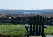 Adirondack chair with a view of the Wachusett Reservoir.