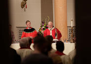 Archbishop of Boston Seán Cardinal O'Malley, O.F.M. Cap. talks to members of the community. Photo by Tom Rettig