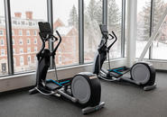 Exercise equipment in The Jo with views of upper campus through the windows