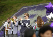 SCONE plays in front of a large Holy Cross 175th logo painted onto the grass. Photo by Tom Rettig