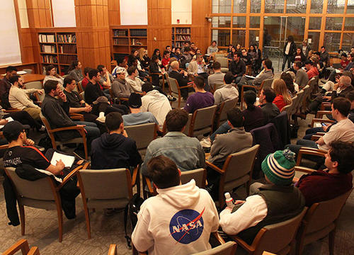 Students, faculty and staff discuss the topic of guns in a moderated fishbowl.