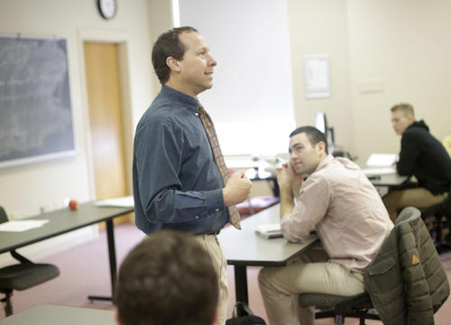 Victor Matheson, professor of economics, is seen here teaching a class at Holy Cross in 2018. Photo by Tom Rettig