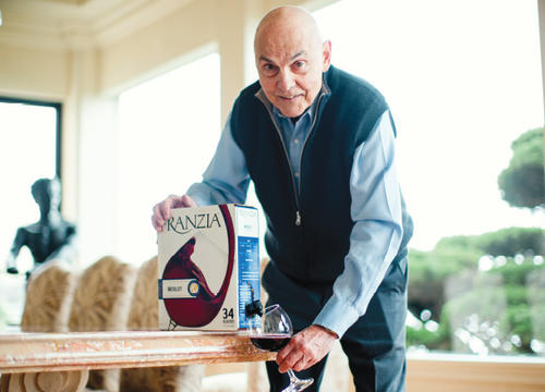 Art Ciocca '59 pours a glass from the iconic, innovative box of Franzia Merlot