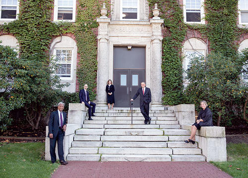 The Sanctae Crucis honorees stand on the front steps of ivy-covered Wheeler Hall