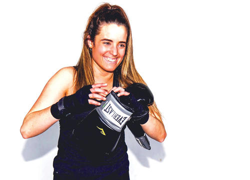 Mary Kate Vanecko '17 posts with boxing gloves in her senior year at Holy Cross