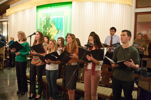 students singing during Mass in Mary Chapel