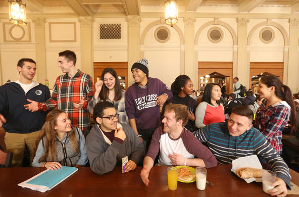group of students conversing in Kimball Main Dining Hall