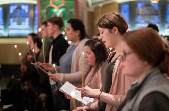 members of the Holy Cross community take part in a multifaith prayer
