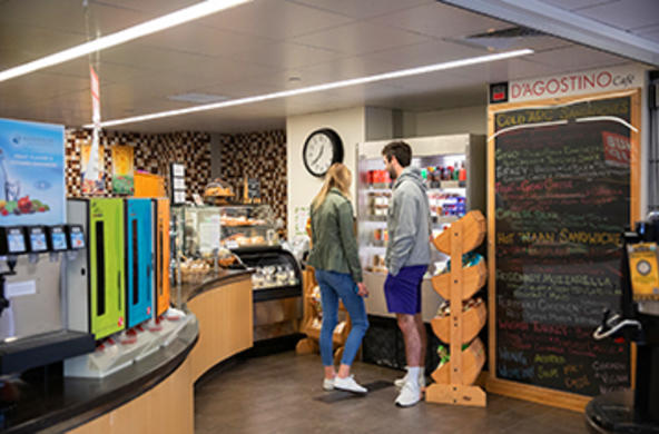 Two students browsing the food selection in D’Agostino Cafe