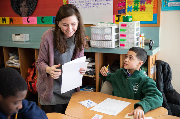 Lily Cook '17 teaches children at the Nativity school using religious curriculum developed by students via the Ignite Fund.