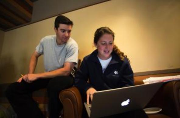 two students looking at a computer