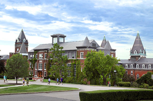 Smith Hall with students traversing campus