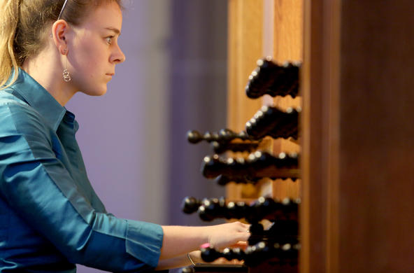student playing the organ
