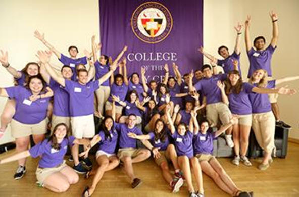 a large group of students wearing purple tshirts