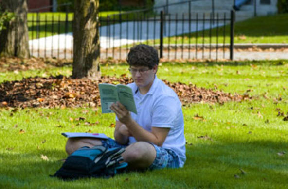student reading outside