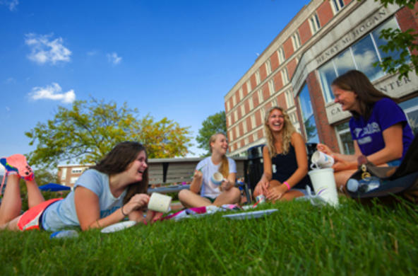 students lounging on the Hogan Courtyard