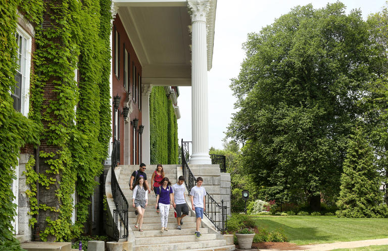 group of students walking down Fenwick Hall stairs