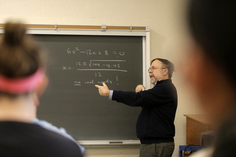 John Little, professor of mathematics, teaching a class 