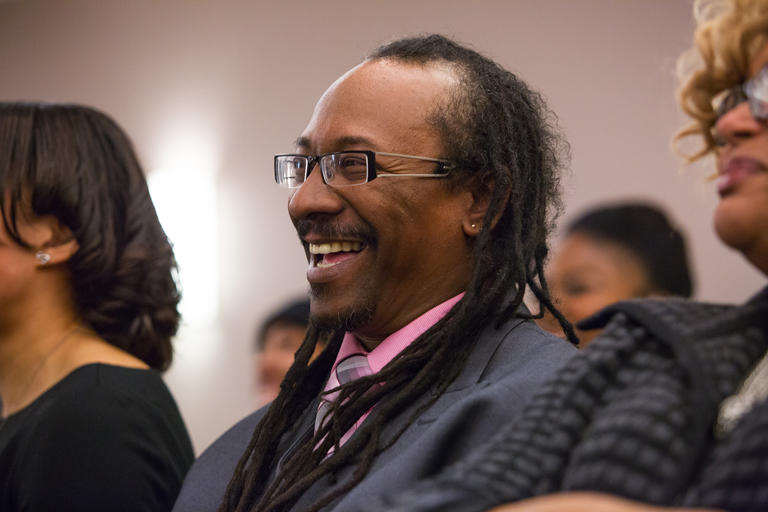man smiling at an event
