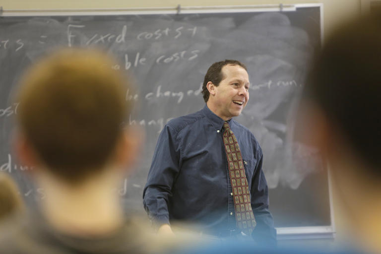 Victor Matheson, a professor in economics and accounting, teaching a class.