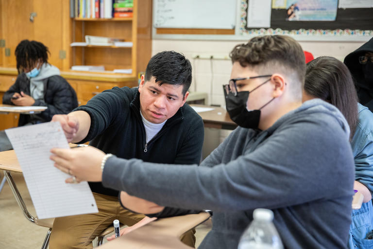 Josh Delgado '15 working with a student in his Math class at Burncoat High in Worcester.