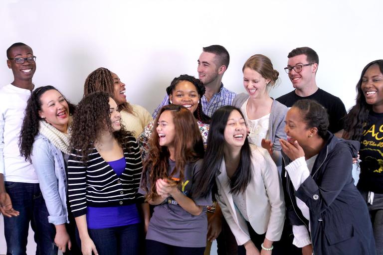 Photo of a group of college students sharing a laugh.