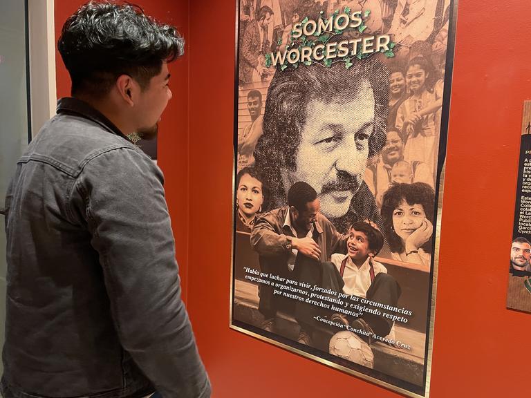 Student Cesar Grande visiting the SOMOS Worcester exhibit, part of the Latino History Project, at the Worcester Historical Museum.