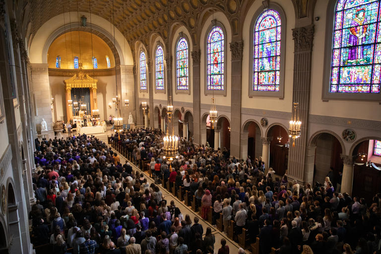 View inside of the chapel as people participate in Mass