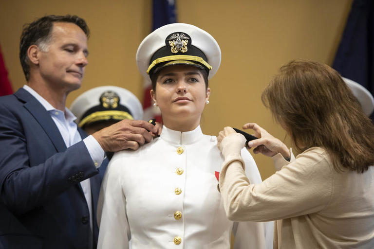 NROTC graduate being pinned by family