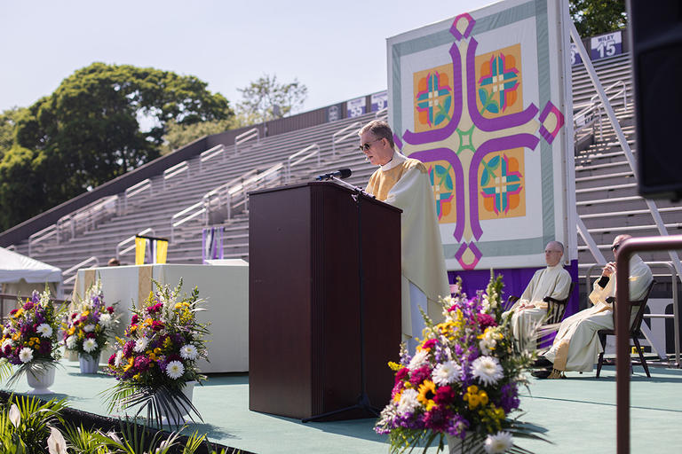 Fr. Boroughs, president of Holy Cross, delivers the homily during Baccalaureate Mass 