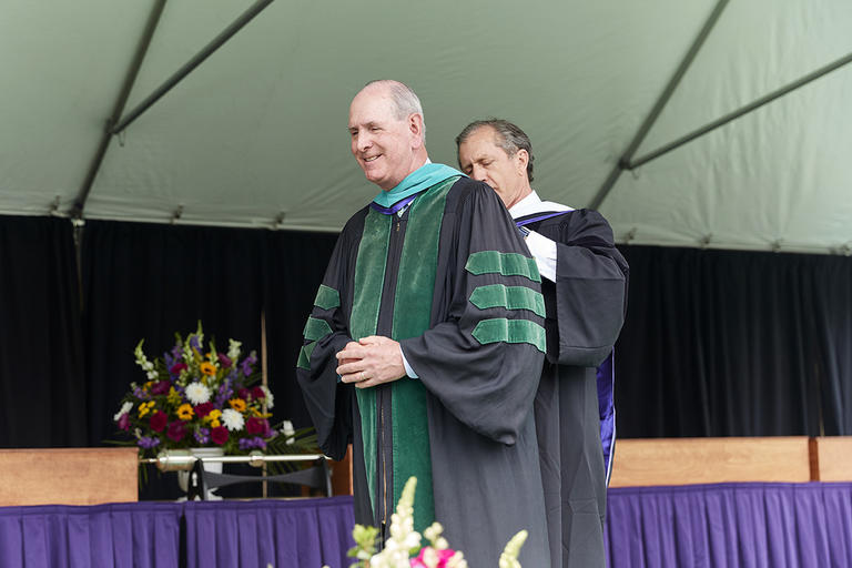 Michael Francis Collins, M.D. ’77 receives an honorary degree during Commencement Exercises