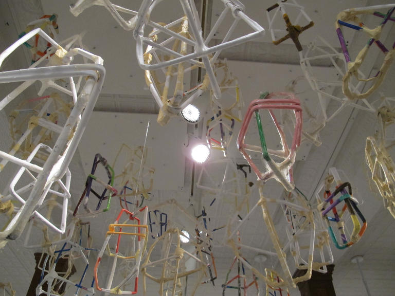 Installation view of suspended sculptures by Jeremy Burleson
