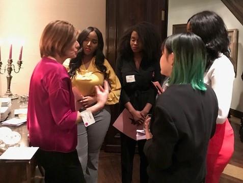 Group of women standing in conversation