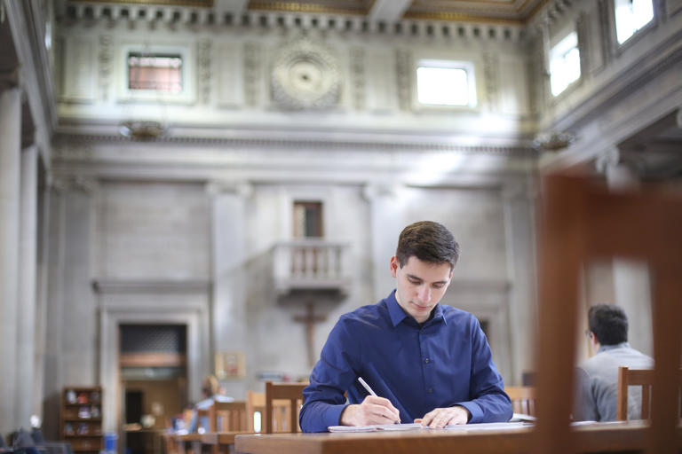 Student working in Dinand Library
