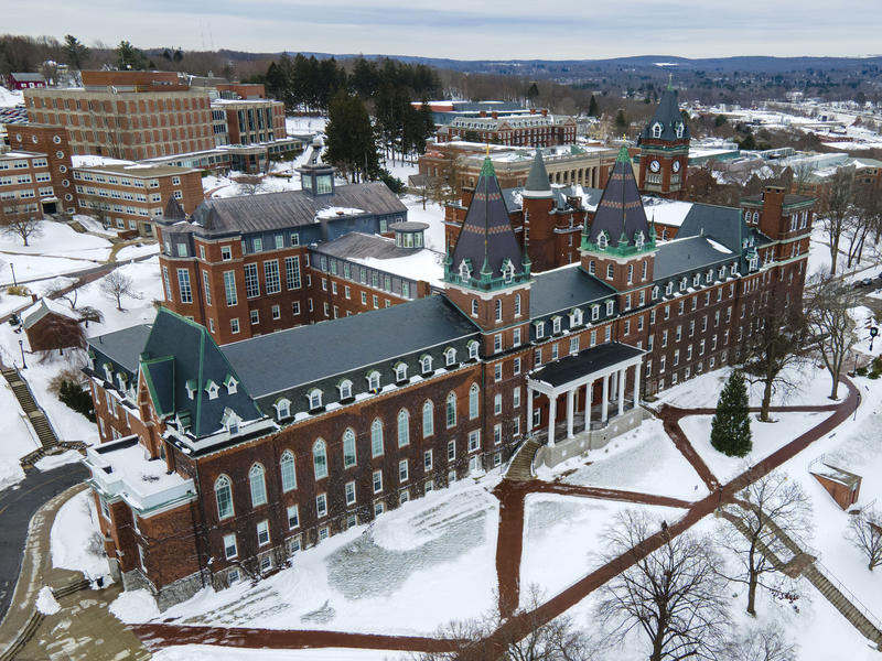 Aerial view of snow covered Holy Cross campus.