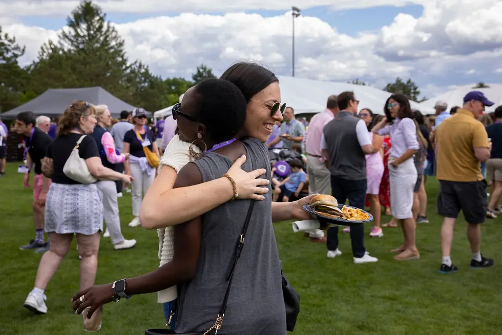 two folks hugging at a picnic
