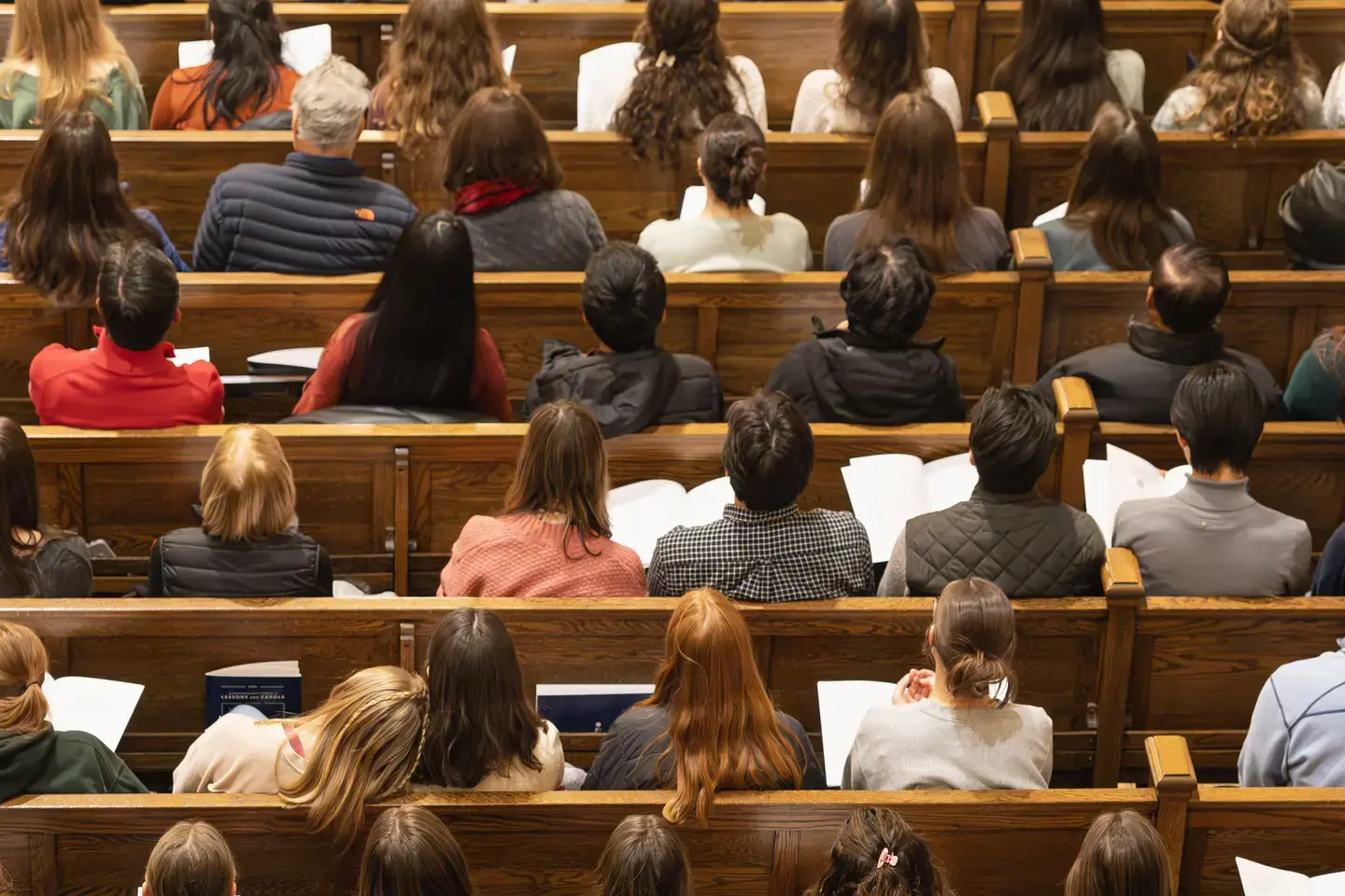 people sitting in the pews of a church