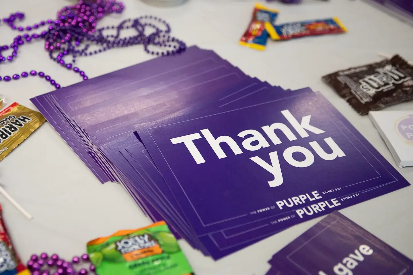 a stack of thank you card on a table
