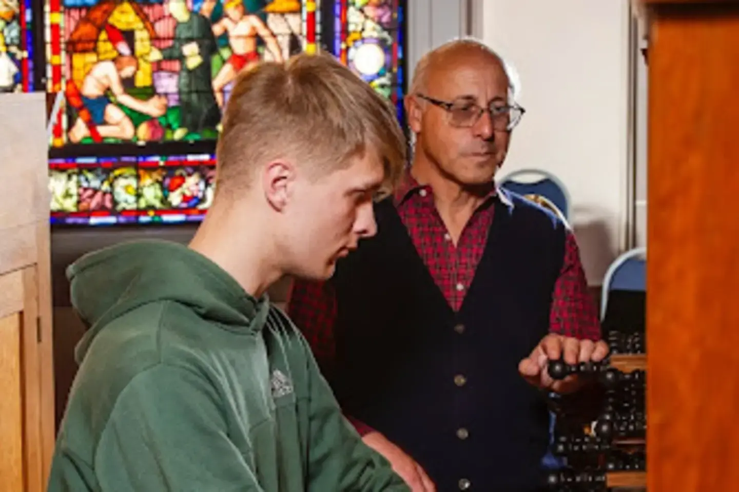 An organ student plays