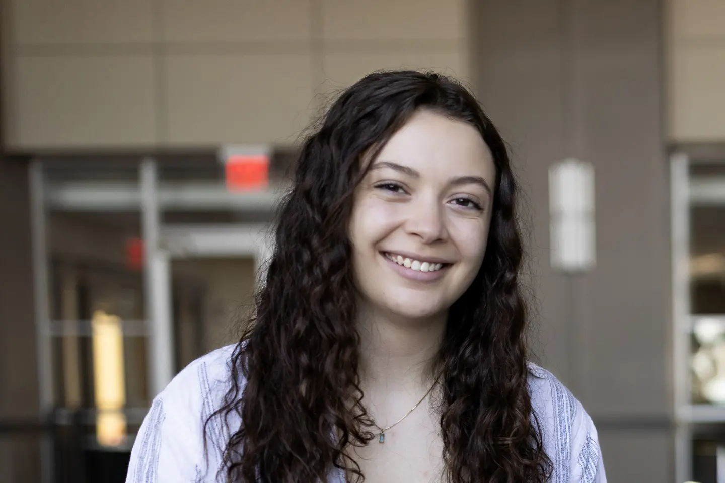 Delaney Walch, woman with long curly brown hair