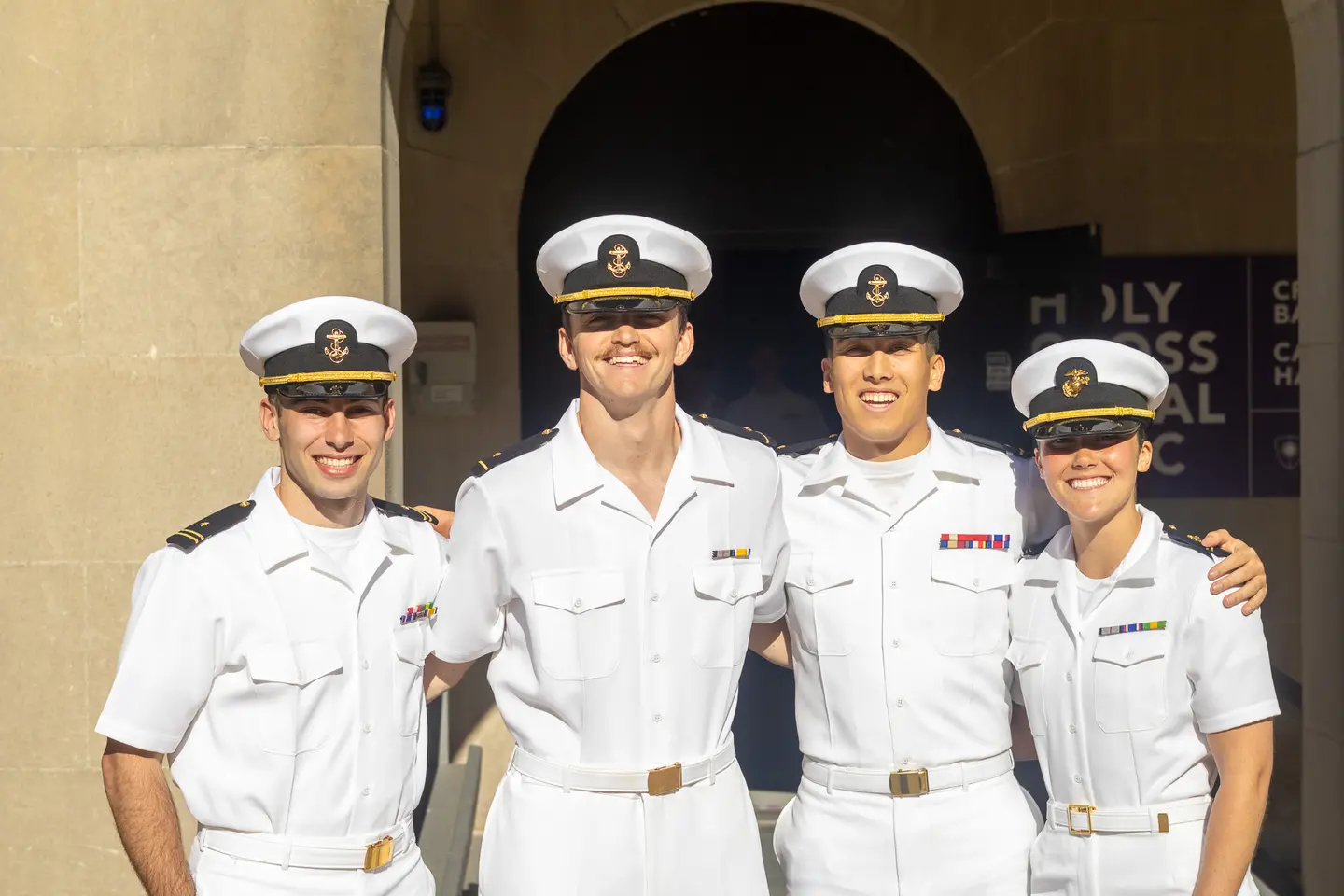 A group of midshipmen pose for a photo
