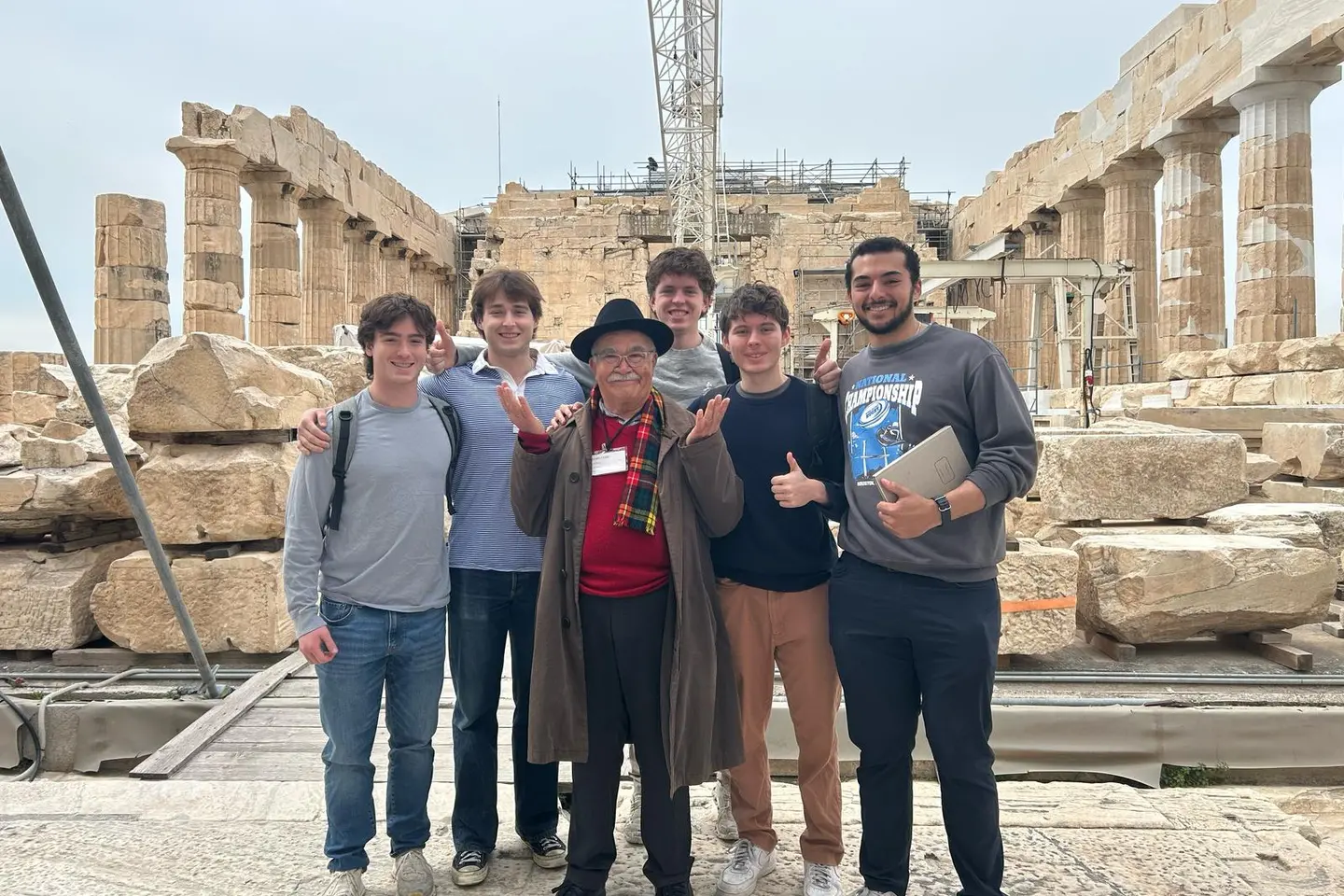 Students pose with an instructor while studying abroad